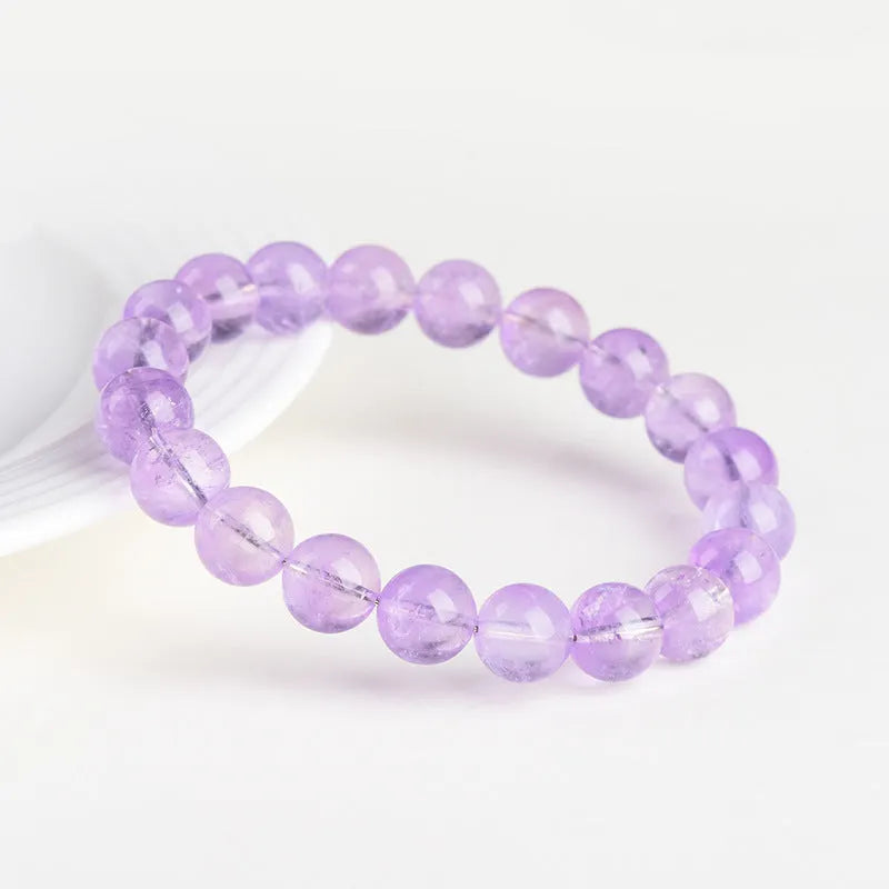Lavender amethyst crystal bracelet with water ripple pattern on round beads in light purple colour