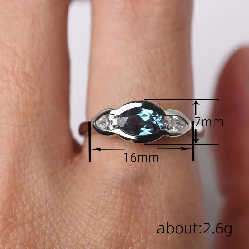 Women's geometric ellipse ring in white gold finish with inlaid zircon stones on copper
