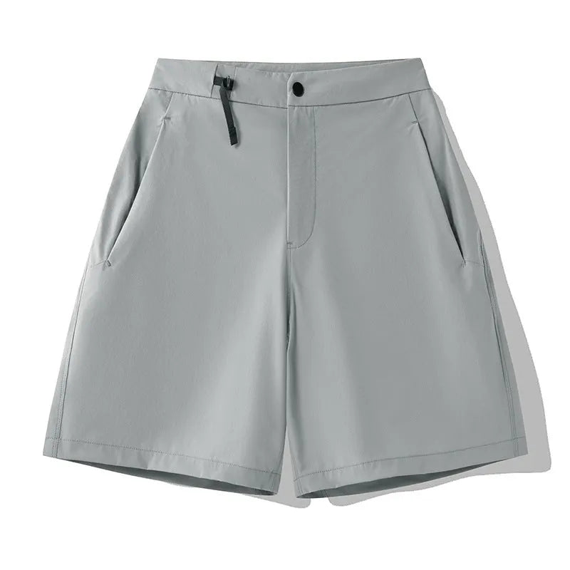 Men's solid colour quick-drying sports shorts with elastic waist, shown in army green.