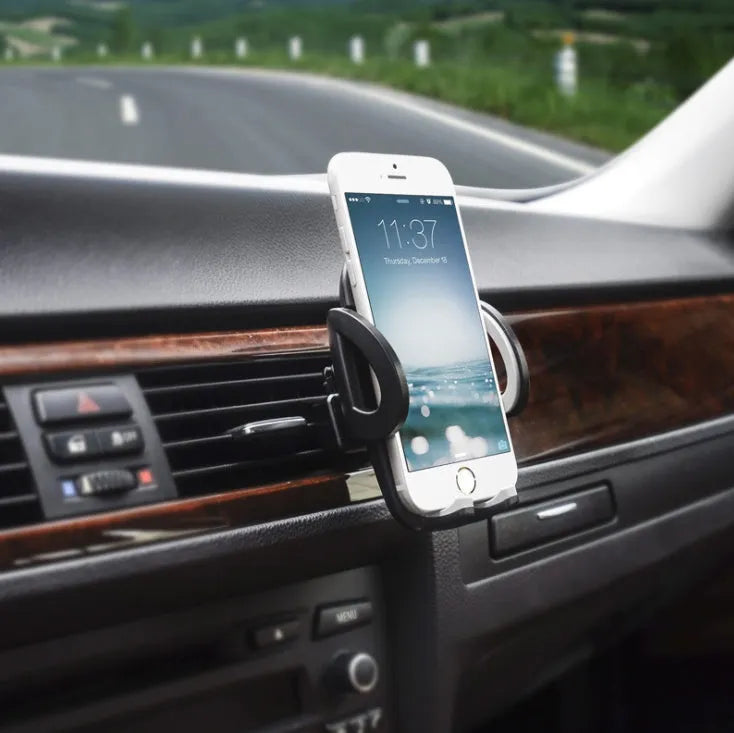Black plastic car air conditioning vent mobile phone holder showing adjustable clamp for universal device mounting.