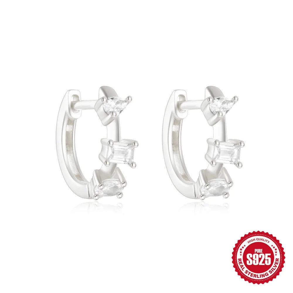Sterling silver geometric stud earrings with small round diamond design in gold and silver finishes