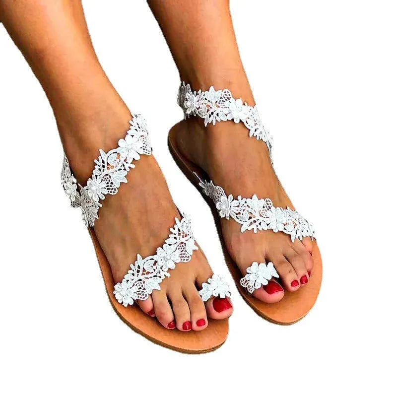 White women's flat shoes with rhinestone and floral pattern on patent PU upper, round toe, low back.