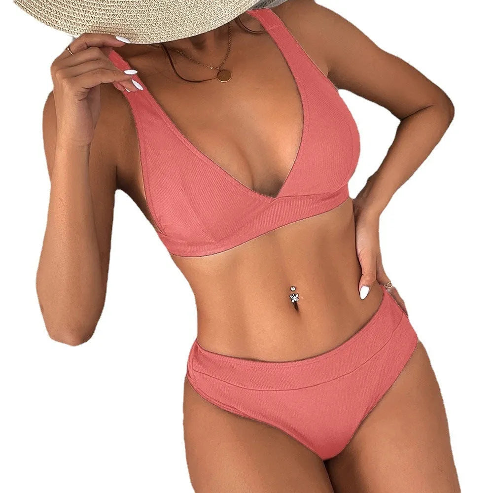 Women's black bikini set with rib lace-up front detail and split-style bottom.