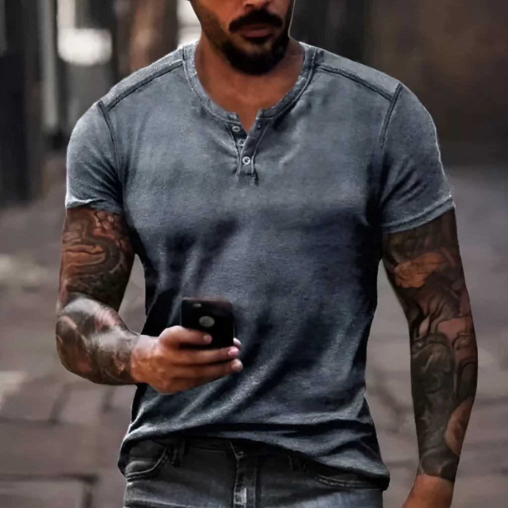 Men's grey short sleeve t-shirt with a raised 3D printed design on the lapel button.