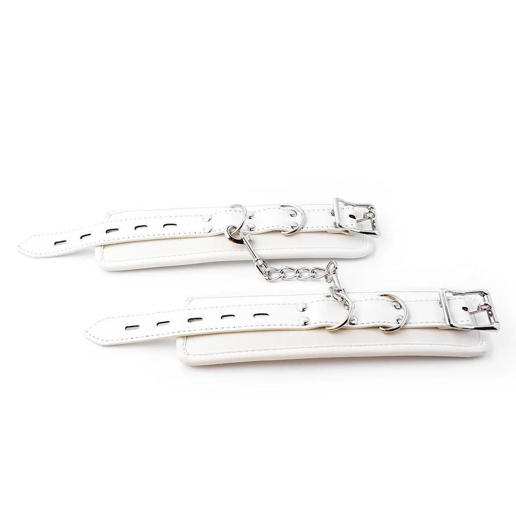 White PU sponge bondage set showing handcuffs, footcuffs and neck scarf with adjustable straps