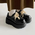 Black women's lace-up shoes with English muffin heels and round toe