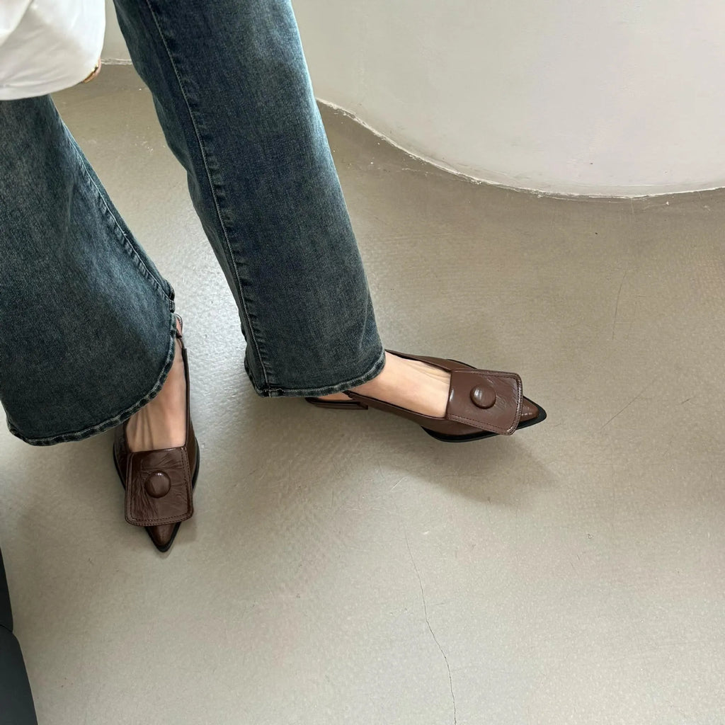 Women's low heel pointed toe sandals with an ankle strap in apricot colour.
