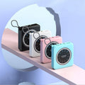 Mini alloy power bank in mint green, pink, or white showing multi USB ports and compact size.