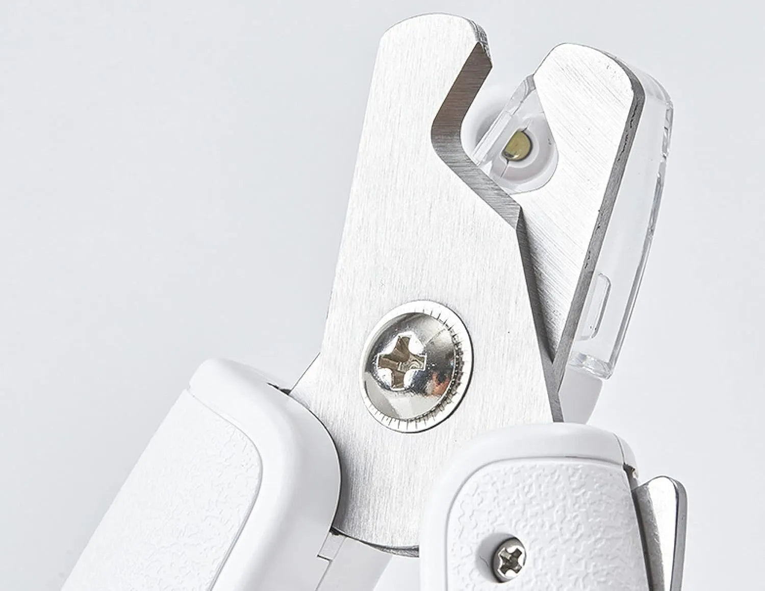 White LED pet nail clipper with transparent anti-splash guard open, showing triangular stainless steel blade