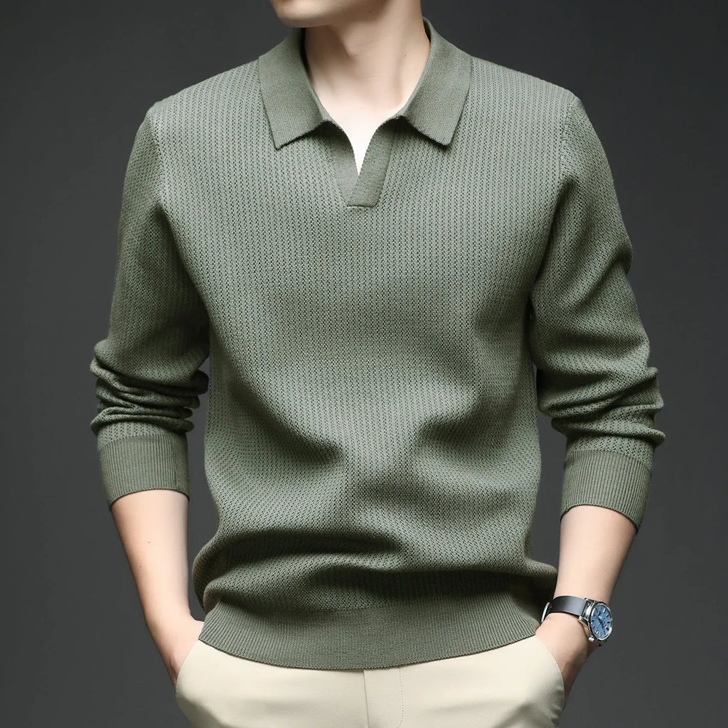 Men's loose green pullover sweater for casual autumn wear on a hanger