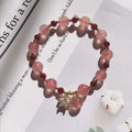 Handmade strawberry quartz crystal bracelet with Hetian jade peach blossom charm for women
