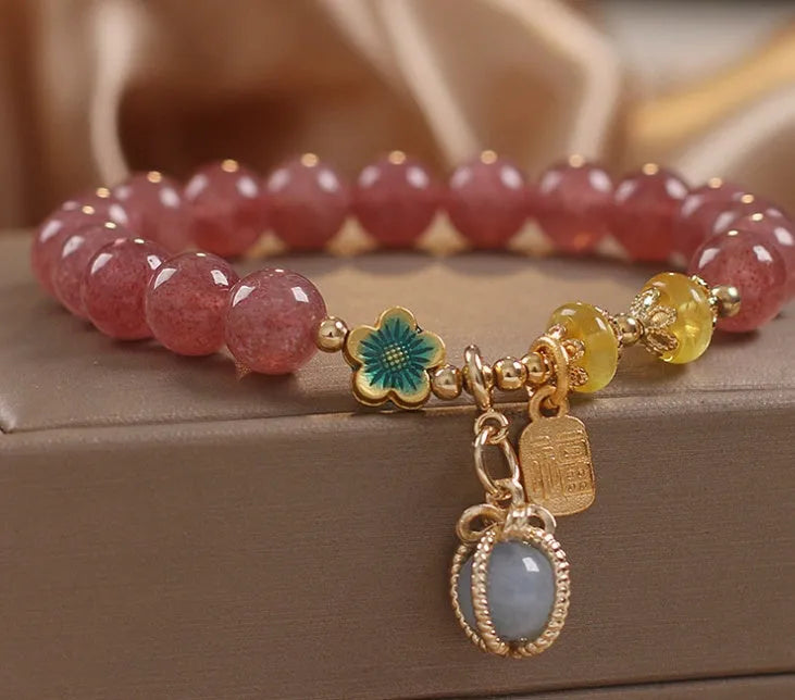 Red women's bracelet with strawberry quartz beads, alloy metal, and rhinestone detailing