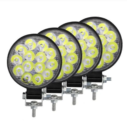 Compact round 42W LED work light with aluminium housing for car, truck, or motorcycle.