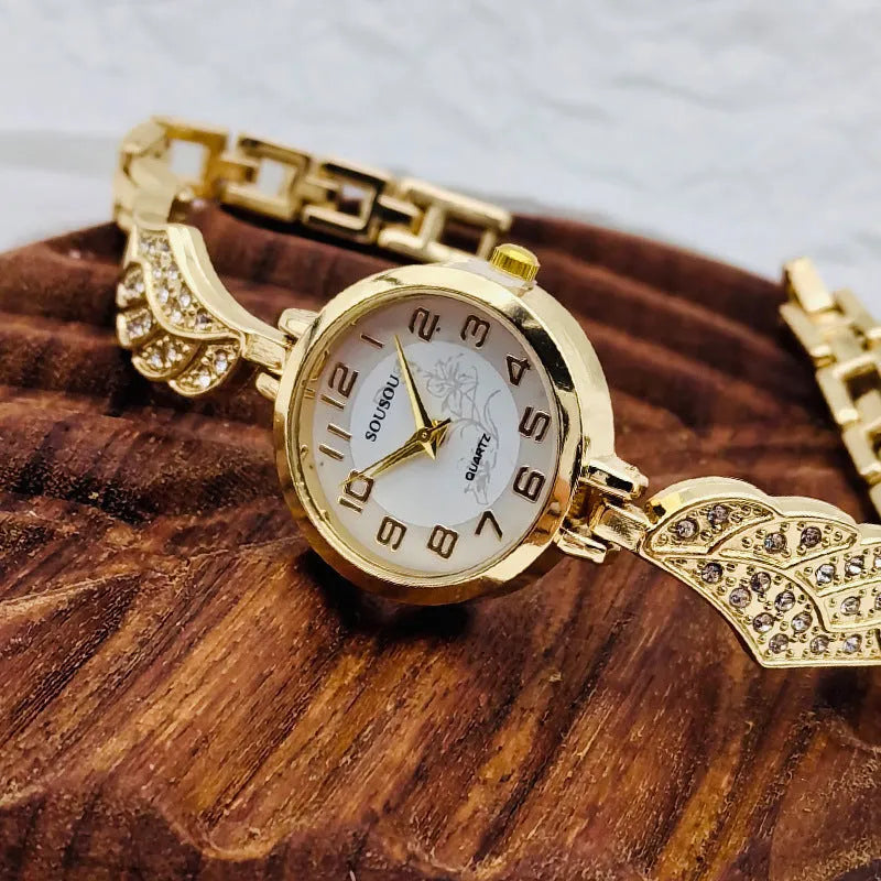 Stainless steel women's watch with round dial and Vachette clasp on wrist.