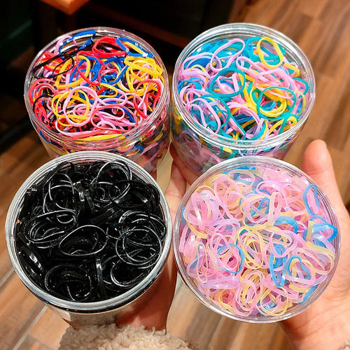 Multi-colour TPU baby hair bands in a reusable container, 300 or 600 piece pack.
