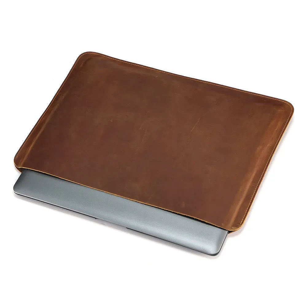 Brown genuine leather horizontal computer liner bag with cowhide lining showing interior compartments