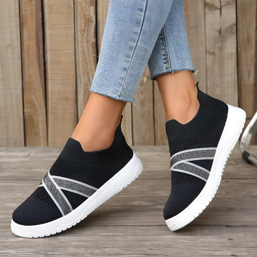 Black women's flyknit mesh casual shoes with flat rubber sole and tassel detail