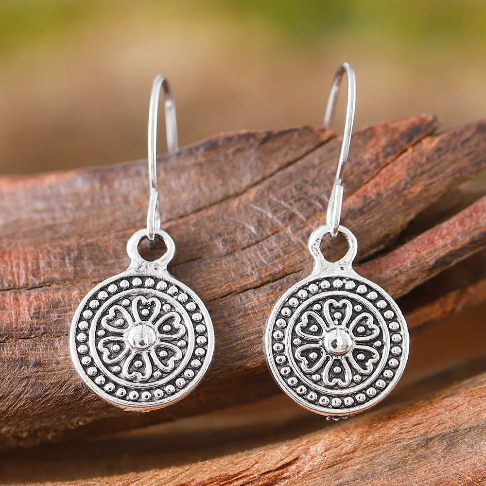 Geometric round earrings with distressed ethnic print in zinc alloy with electroplated finish