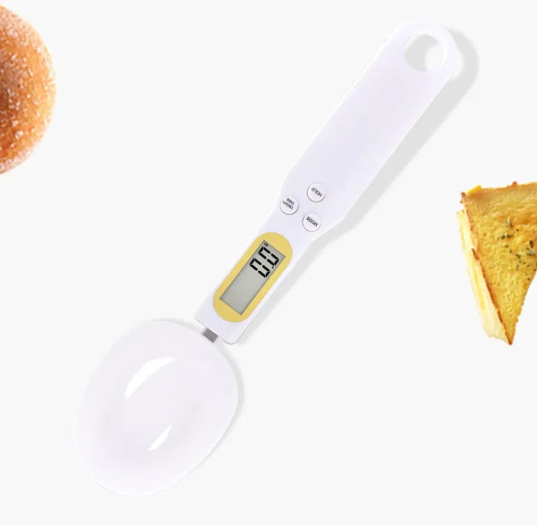 Black electronic measuring spoon scale showing digital display and spoon bowl for kitchen weighing