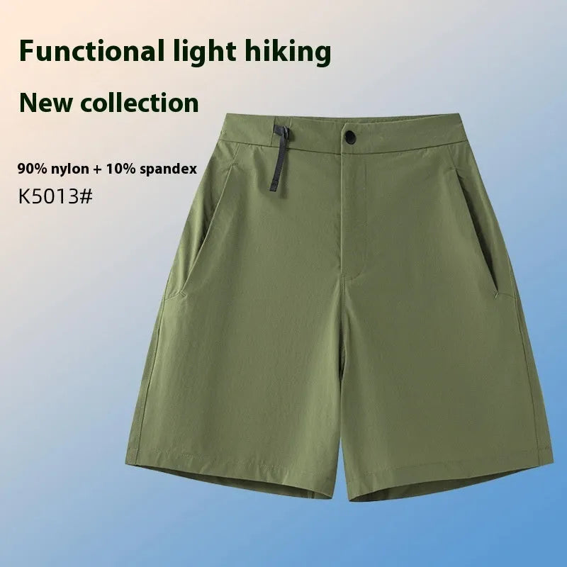 Men's solid colour quick-drying sports shorts with elastic waist, shown in army green.