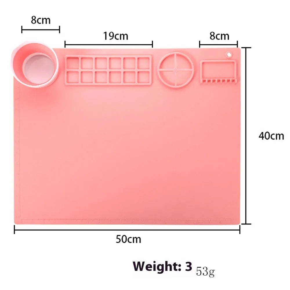 Silicone double bowl painting mat for watercolour art in various colours on a table