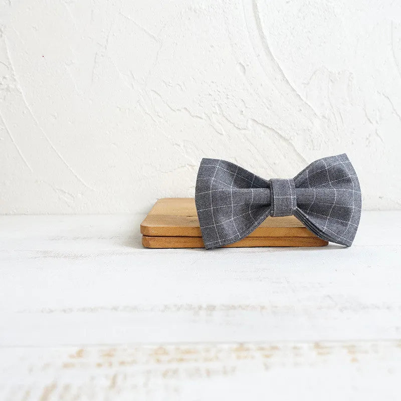 Grey polyester dog bow accessory in five sizes, 10-11cm by 6cm, for dog collars