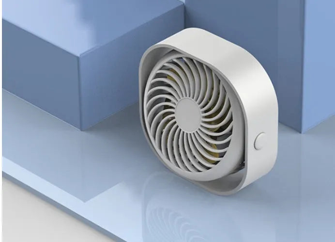 USB-powered alarm clock style desk fan with rotating head in blue, pink, white, or green.
