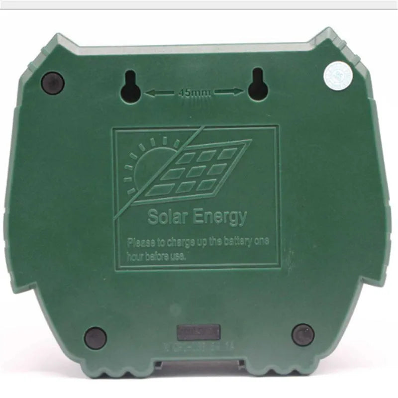 Green solar-powered ultrasonic animal repeller with dimensions 12x13x5cm
