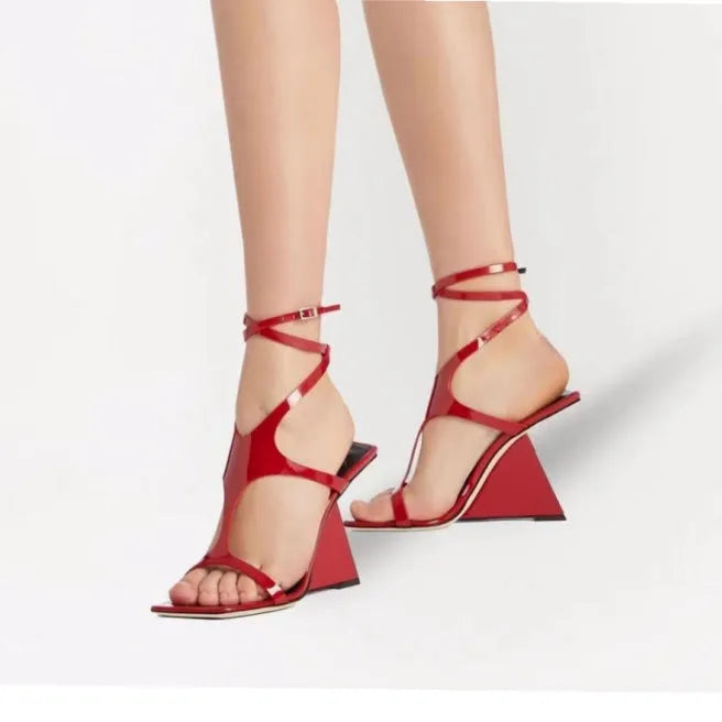 Women's black high heel sandals with square toe and button fastening on a 9.5cm heel.