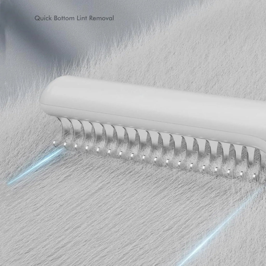 Stainless steel dematting comb for dogs with a user-friendly handle on a pink background.