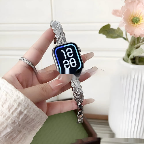 Zinc alloy twist-design Apple Watch band in silver, rose gold, gold, black, and starlight colours on a grey background.