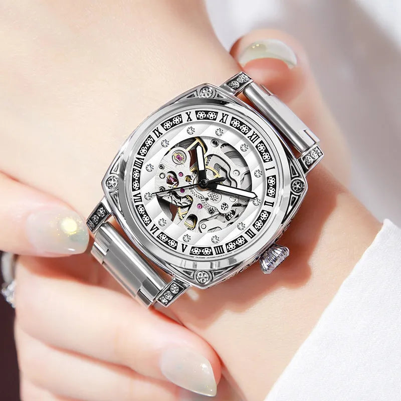 Leather strap mechanical watch with luminous hands showing 10 metre water resistance rating.