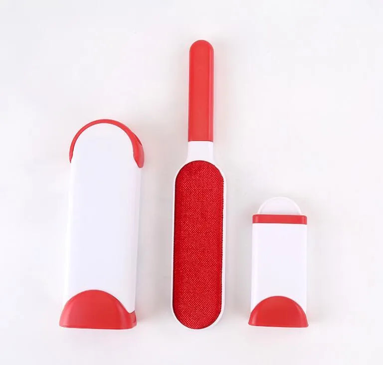 Blue reusable pet hair removal brush with double-sided sticky head placed on its self-cleaning base.