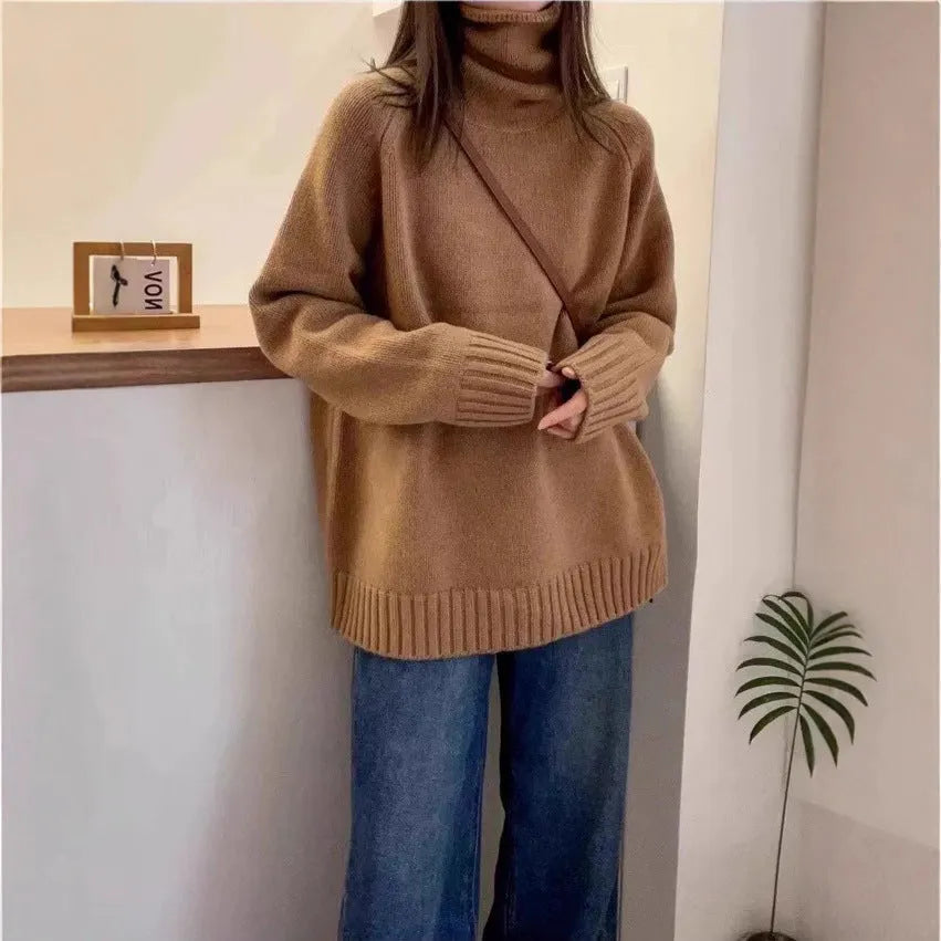 Women's loose thick turtleneck sweater with a curled pile collar in a solid colour.