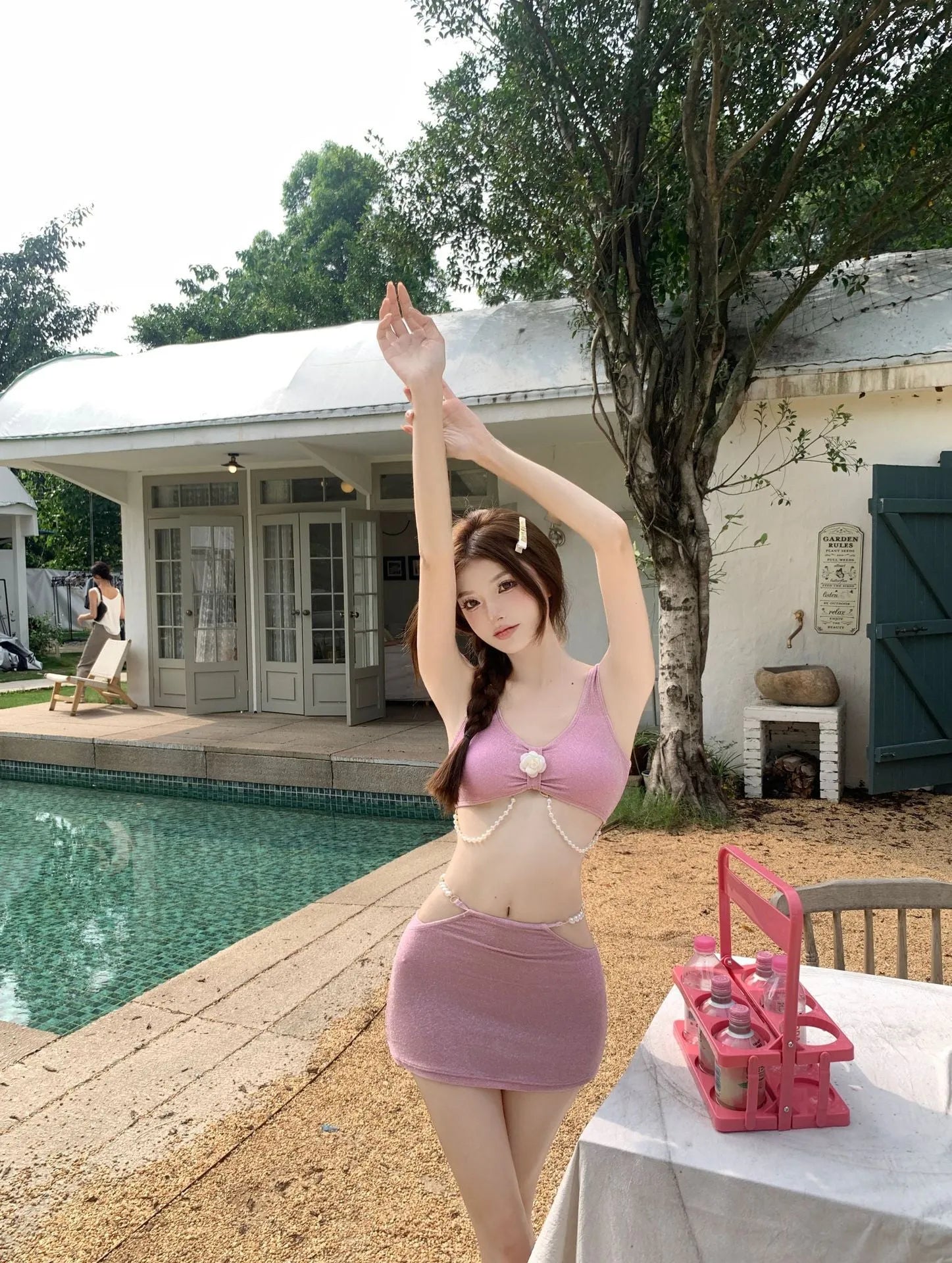 Three-piece bikini swimsuit set in black or pink colour with brief style and backless design