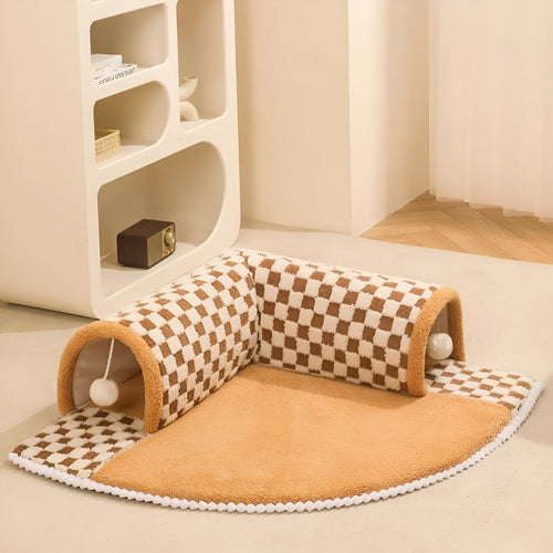 XL sized fan-shaped plush pet bed with integrated tunnel, shown in coffee colour with a non-slip granular base.