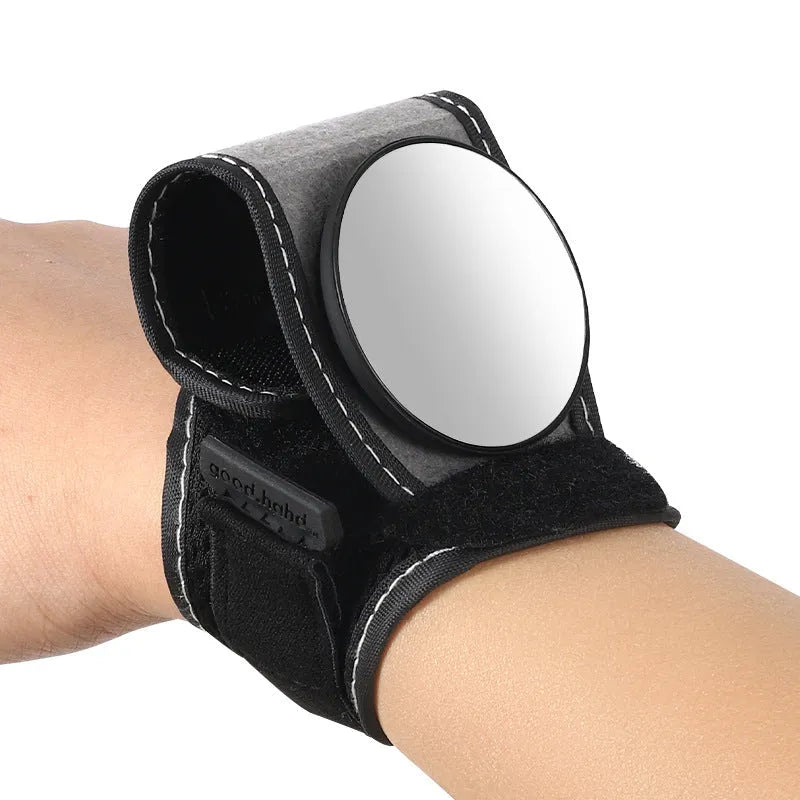 Black nylon wrist-mounted bicycle rear-view mirror with velcro strap and armoured glass reflective surface.