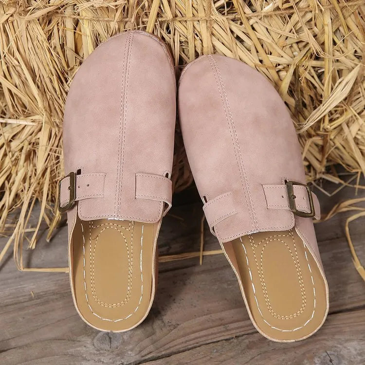 Women's lightweight wedge slippers in various colours with cloth upper and rubber sole.