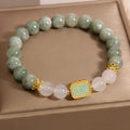 Women's crystal bracelet with oil green emerald stones and a scripture charm