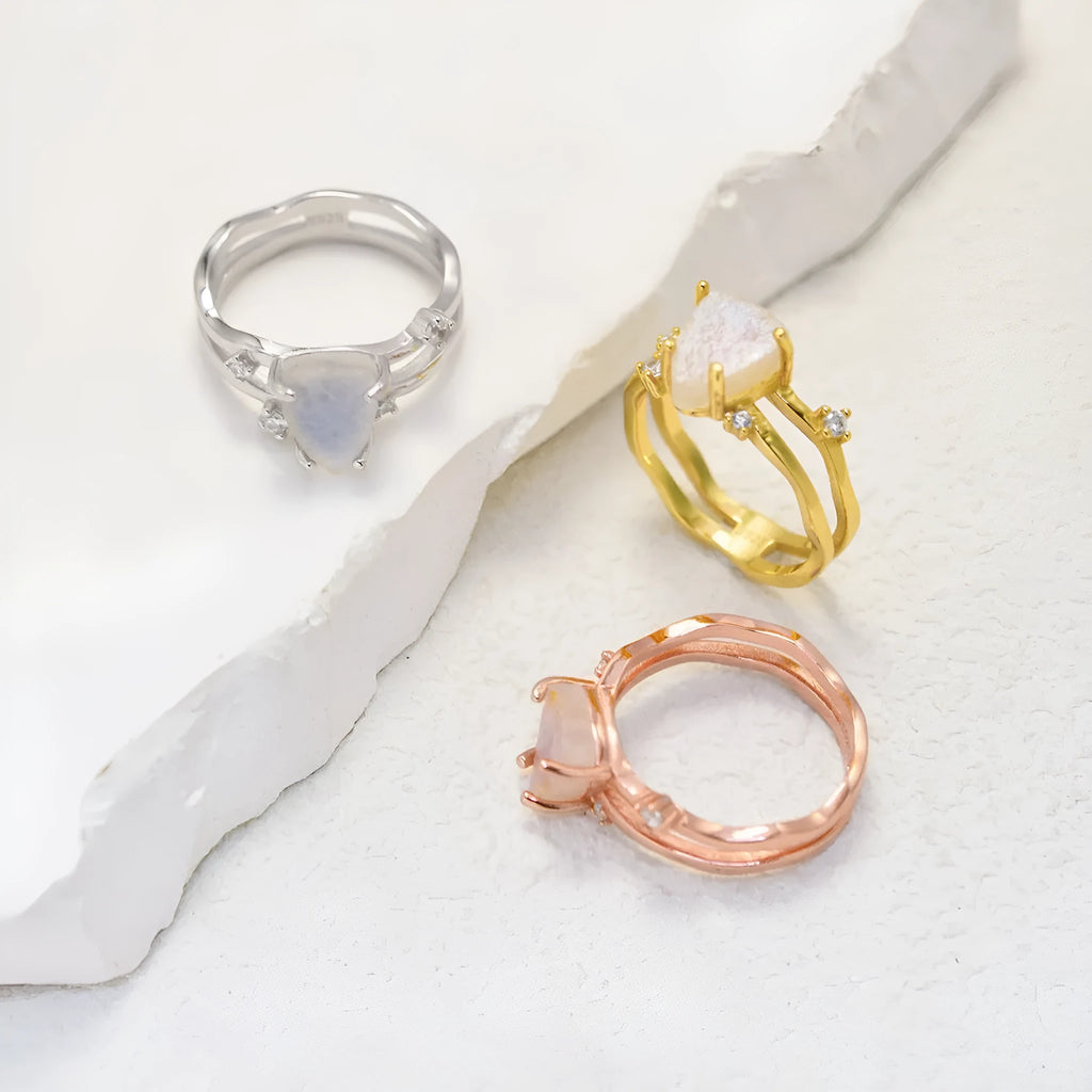 S925 sterling silver ring with triangular geometric design and central moonstone in gold tone plating