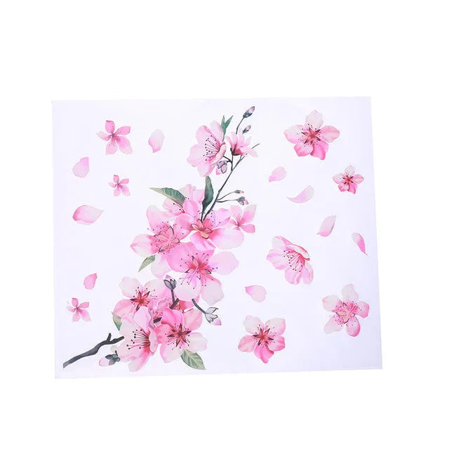 Close-up of a pink and white cherry blossom car sticker on a clear PVC backing.