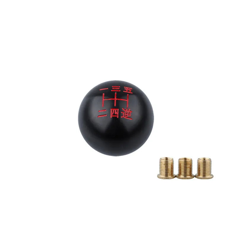 Round aluminium alloy car gear shift head shown in one of five available colour finishes.