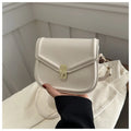 Soft textured PU leather messenger bag with clamshell opening in dark brown colour