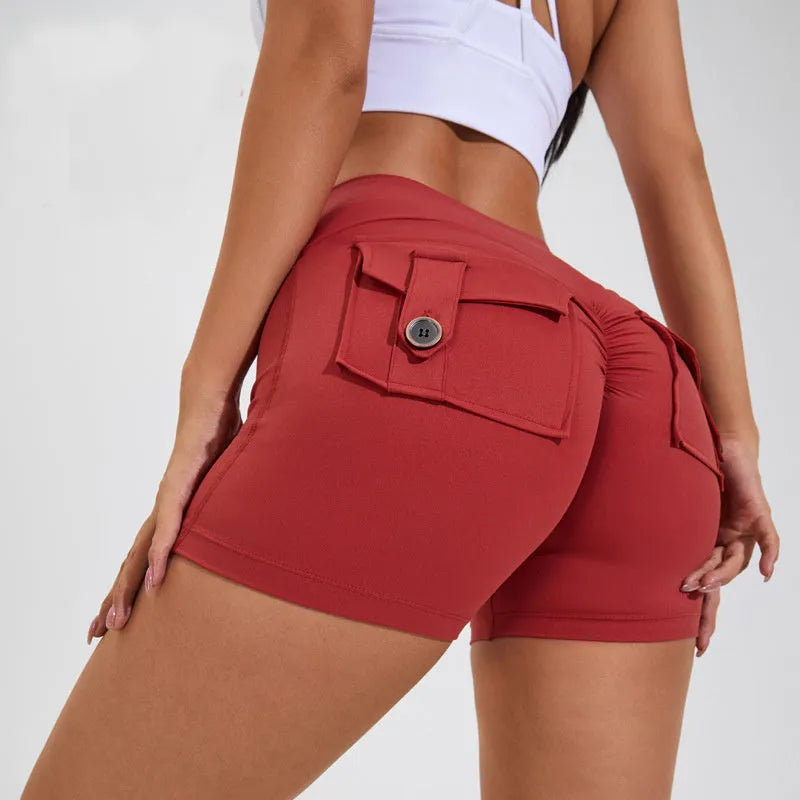 Women's high-waist fitness shorts in quick-dry nylon with side pockets, shown in Electric Blue.