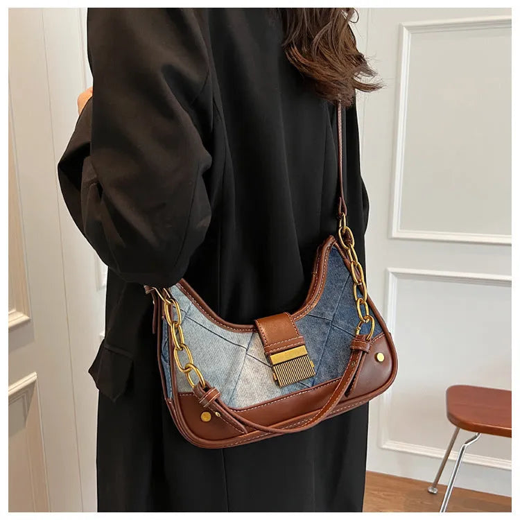 Brown denim women's shoulder bag with diamond mesh pattern and chain detail showing bucket shape
