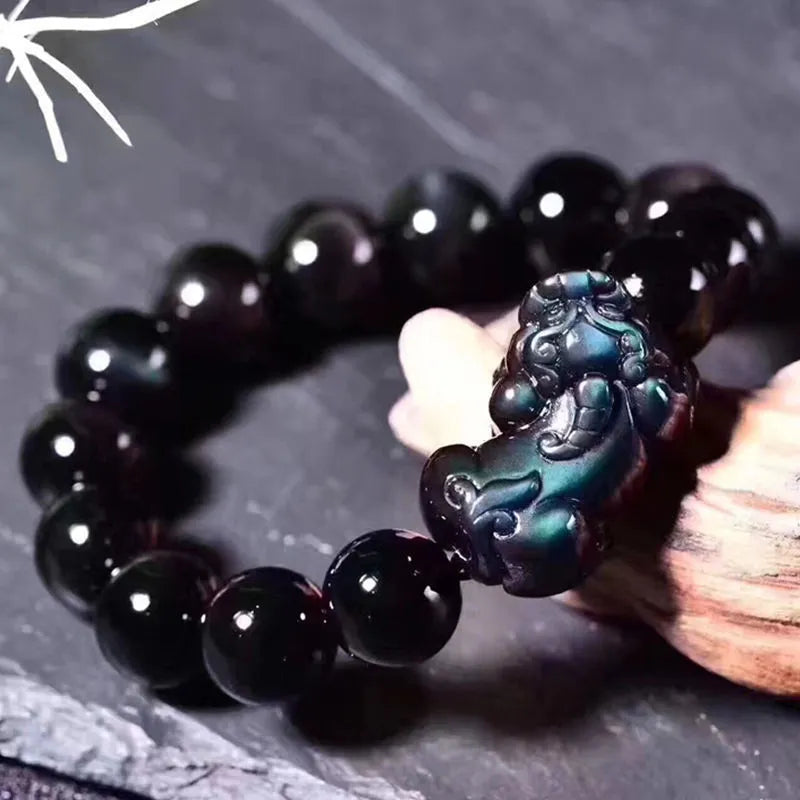 Natural ice colour Eye Obsidian crystal bracelet with elastic band, showing different bead size options.