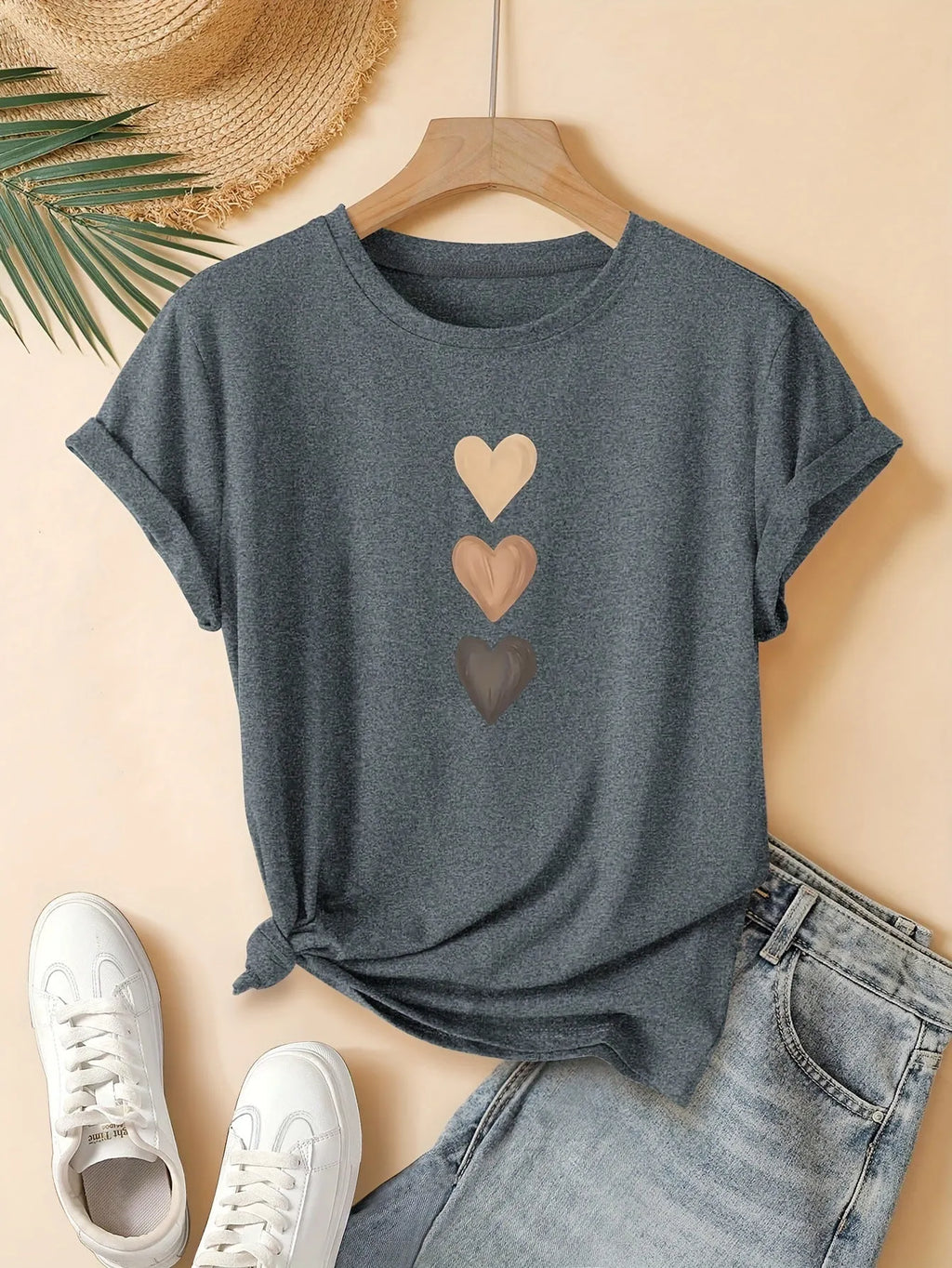 Women's printed cotton round neck t-shirt in blue on a hanger, showing art retro short sleeve design.