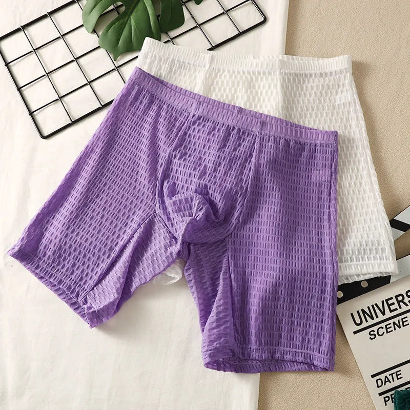 Men's solid colour lace boxer shorts with a lengthened hip lifting design on a size chart.