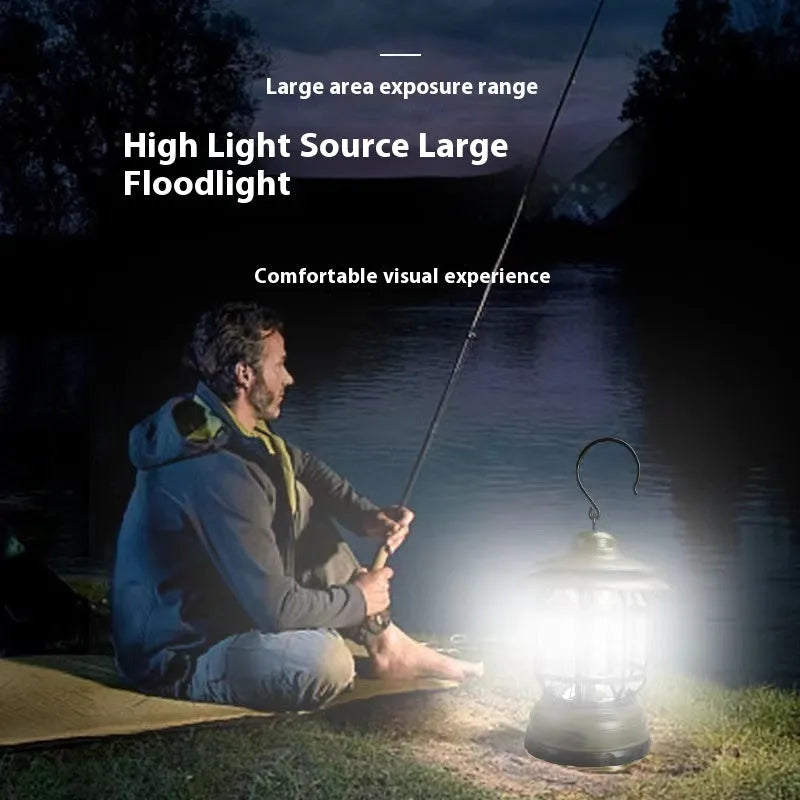 Portable dark green head lamp camping lantern shown on a table with super bright LED light on.
