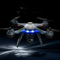 Plastic quadrocopter drone with remote controller and accessories including spare blades